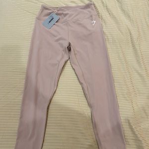 Gymshark brand new tags on leggings size medium, color taupe.